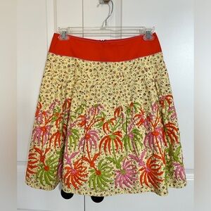 Multi-colored pleated A-line dress in a fun tropical print